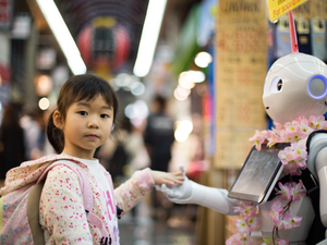 As Kuromon Market in Osaka was about to close for the evening I sampled some delicious king crab and did a final lap of the market when I stumbled upon one of the most Japanese scenes I could possibly imagine, a little girl, making friends with a robot.