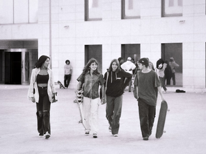 a group of young people walking down a street