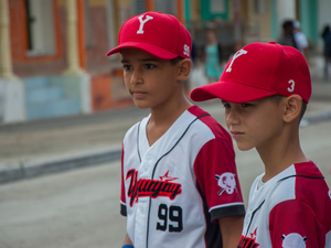 Boys dressing their baseball team