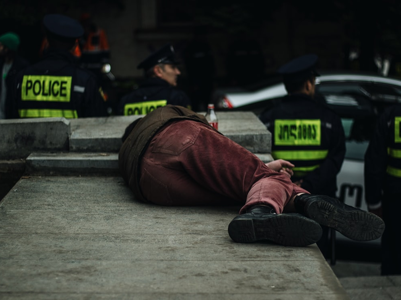 man lying on concrete island