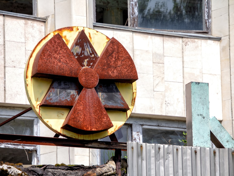 red and yellow radioactive signage at the building