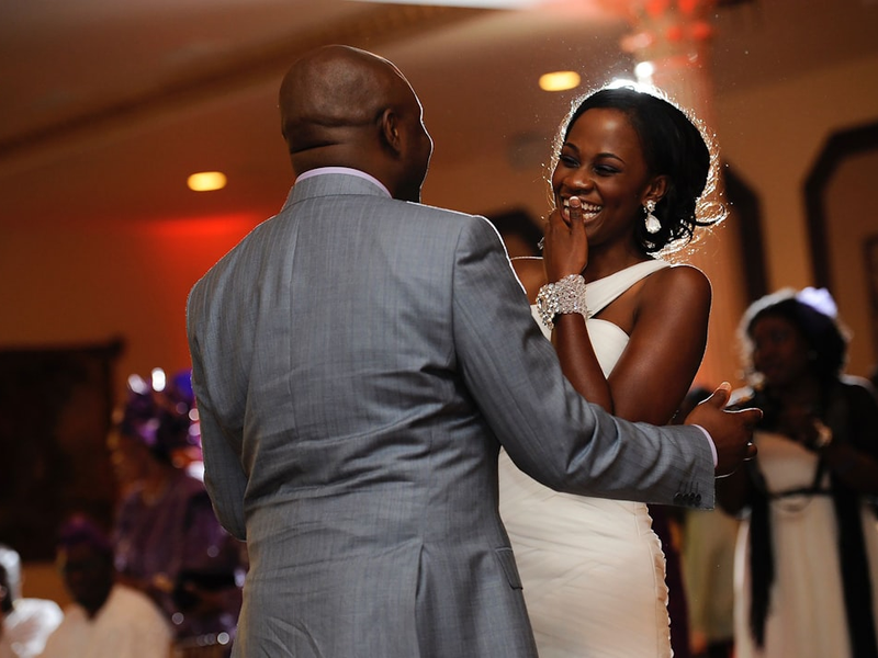 a bride and groom dancing at a wedding reception