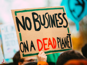 NO BUSINESS ON A DEAD PLANET. Climate change chaos strike demonstration protest