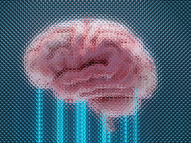 A brain displayed with glowing blue lines.