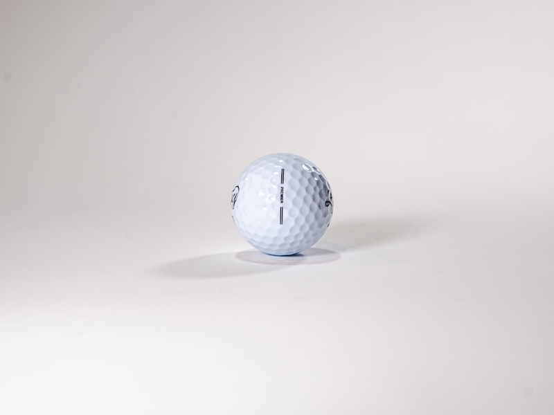 a golf ball sitting on top of a white table