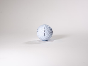 a golf ball sitting on top of a white table