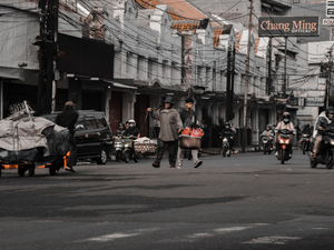 a group of people on motorcycles and scooters on a street