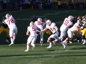 Kevin Hogan Hands Off to Christian McCaffrey