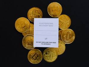 a pile of gold bitcoins sitting on top of a table
