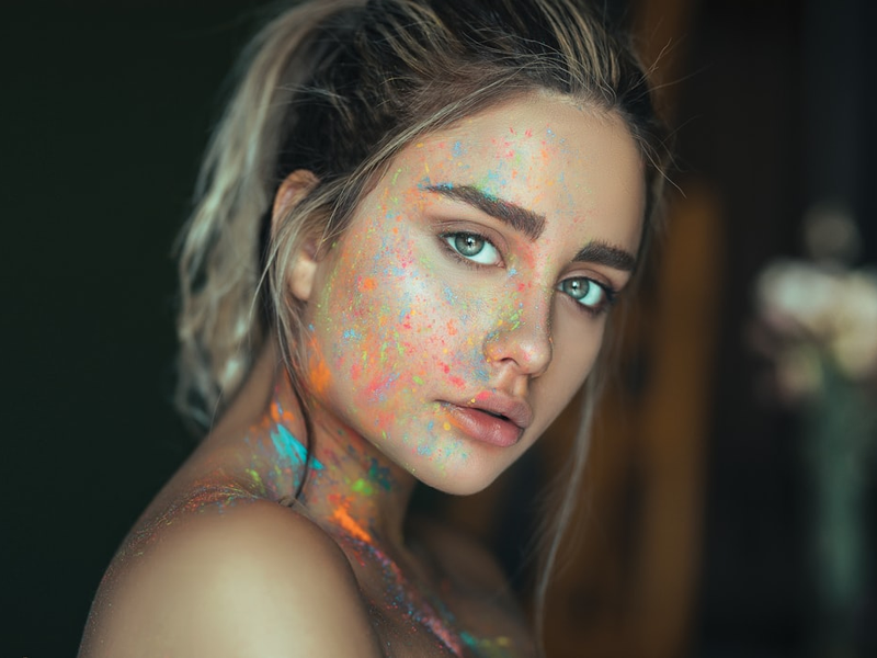 woman with multicolored face paint