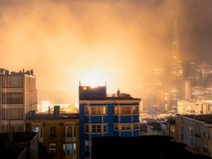 Fourth of July fireworks in the city of San Francisco California at night with buildings