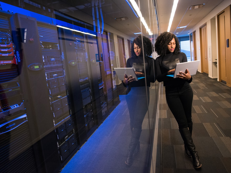 woman in black top using Surface laptop