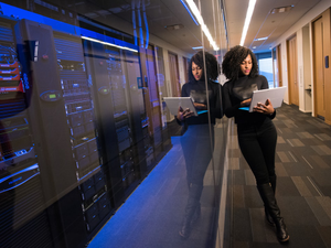 woman in black top using Surface laptop