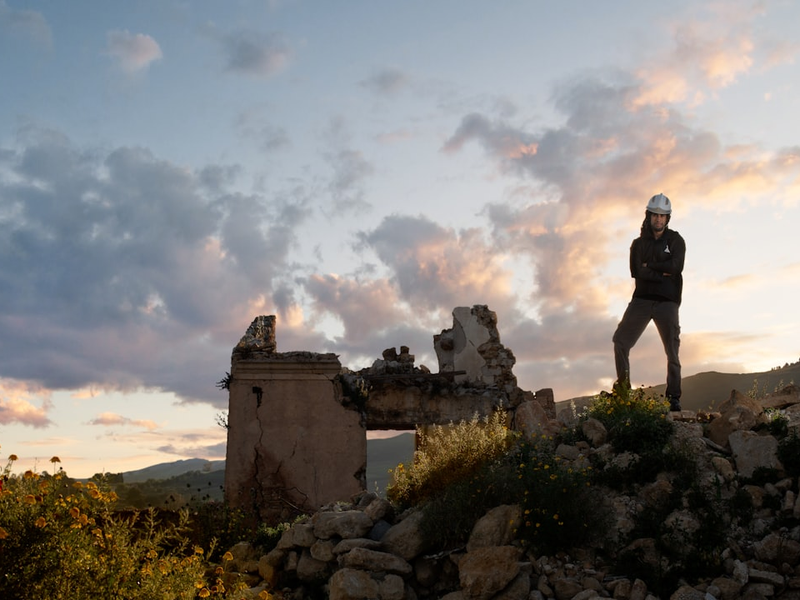 Male structural engineer in earthquake ruins