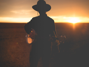 Banjo player sunset