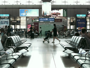 A group of people walking through an airport