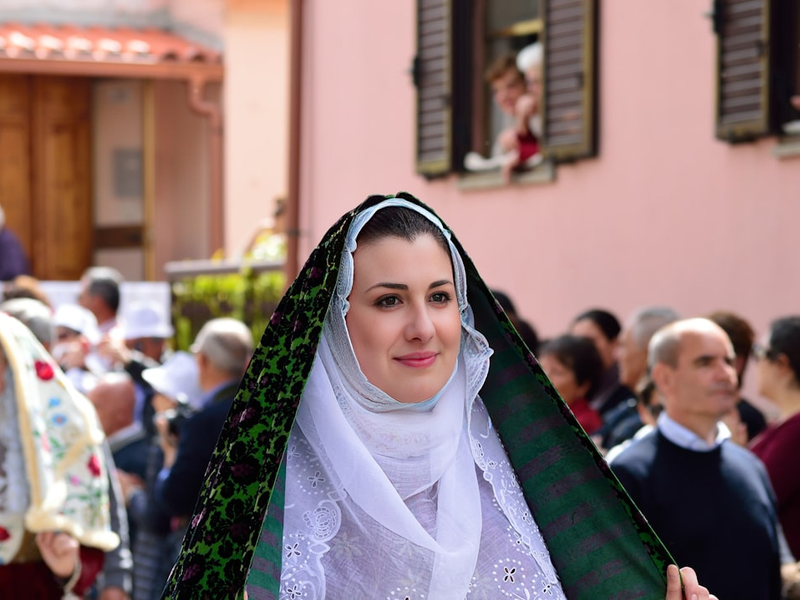 a woman dressed in a white and green outfit