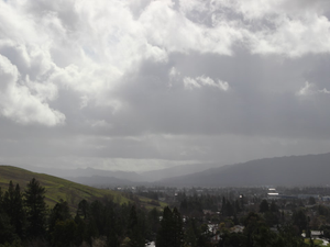 a view of a city with mountains in the background