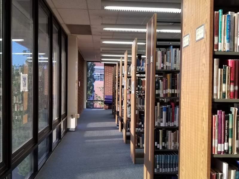 a row of bookshelves filled with lots of books