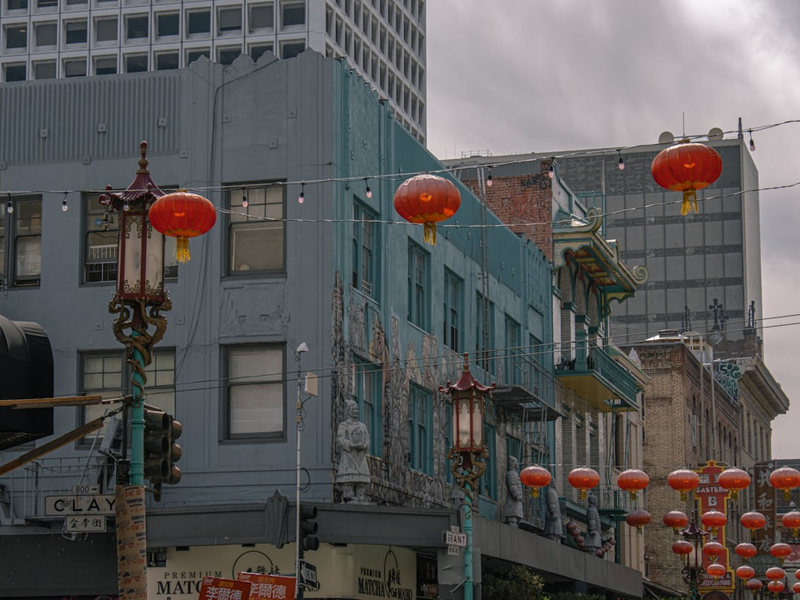 A city street filled with lots of red lanterns