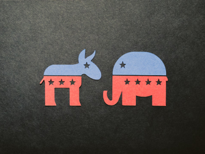 Symbols of Democrat and Republican parties cut out of paper