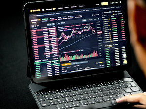 A man is looking at a trading site