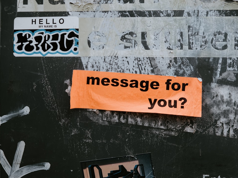 a sign on a wall that says message for you?