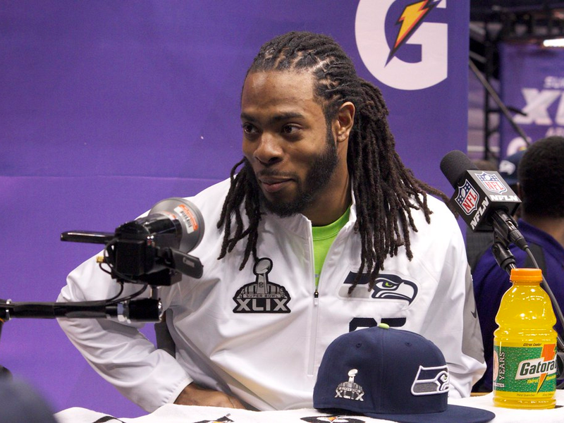 Richard Sherman talks to the media at Super Bowl XLIX media day