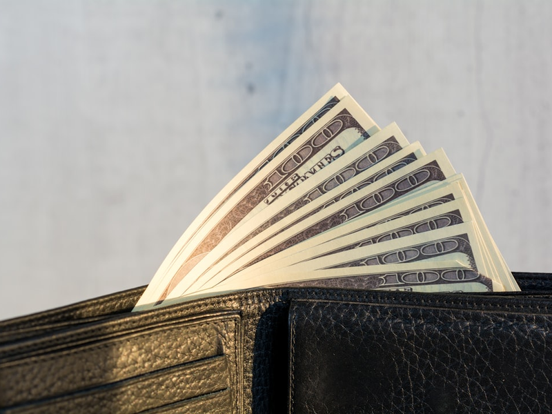 Wallet stuffed with 100 dollars banknotes. Stuffed Leather Wallet. Dollars Bills in Wallet. More of my photos and videos Adobe Stock:http://bit.ly/3RqlciK More of my photos and videos Shutterstock: https://www.shutterstock.com/g/ALEKSANDRBERDYUGIN My email: bermix999@gmail.com