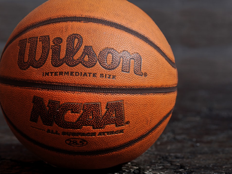 Wilson NCAA basketball on black board