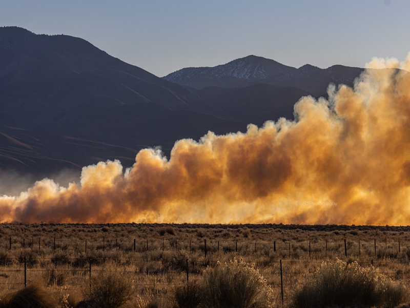 a large amount of smoke billowing out of the sky