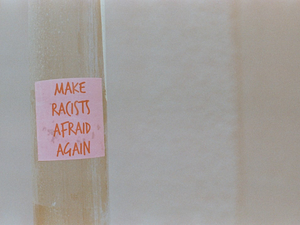 MAKE RACISTS AFRAID AGAIN. Urban street art protest sticker. Leica R7 (1994), Summilux-R 1.4 50mm (1983). Hi-Res analog scan by www.totallyinfocus.com – Kodak Gold 160 (expired 2001)