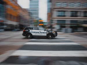 black and white police car on road during daytime