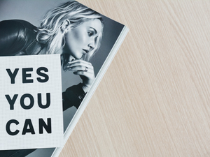 Motivational quote and Jennifer Lawrence in a magazine spread.