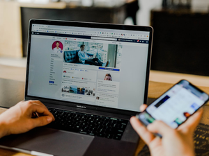 Facebook page of an entrepreneur's social media on desktop and mobile.