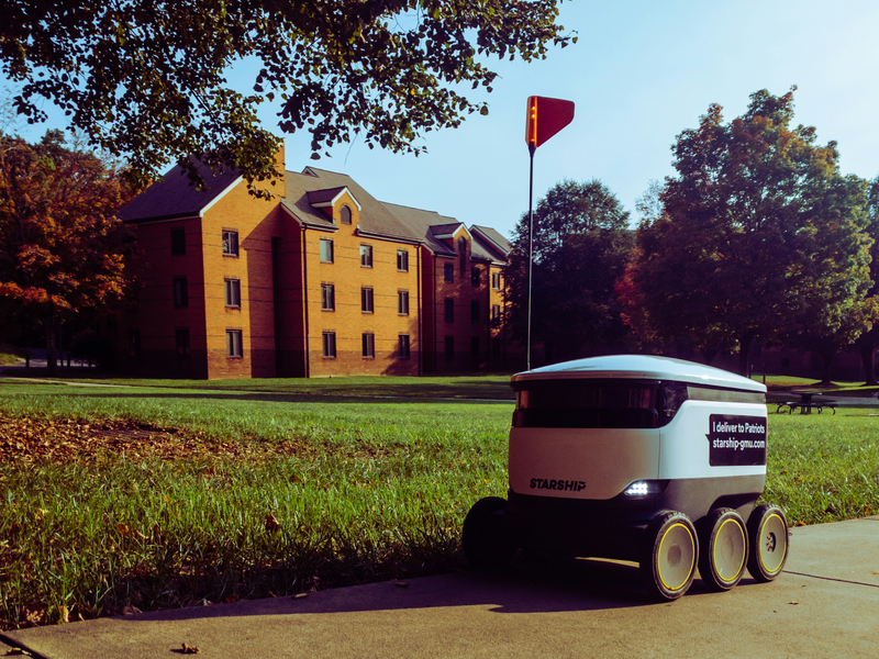 Delivery Robot in Front of a Building