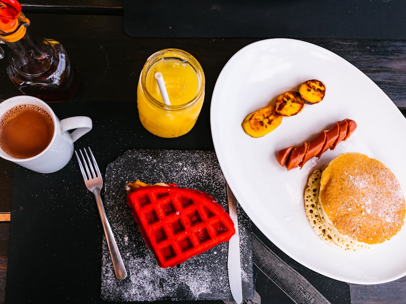 sausage between fried banana and pancake
