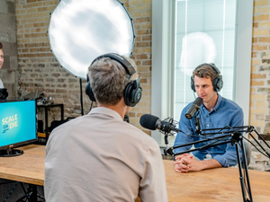 Recording a new podcast interview with CEOs and Founders of successful online businesses, Scale or Die. This show recently hit Apple's New and Noteworthy for business and technology categories. Watch or listen to the most recent episodes at useproof.com/scaleordie.
