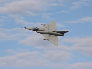 a fighter jet flying through a cloudy blue sky