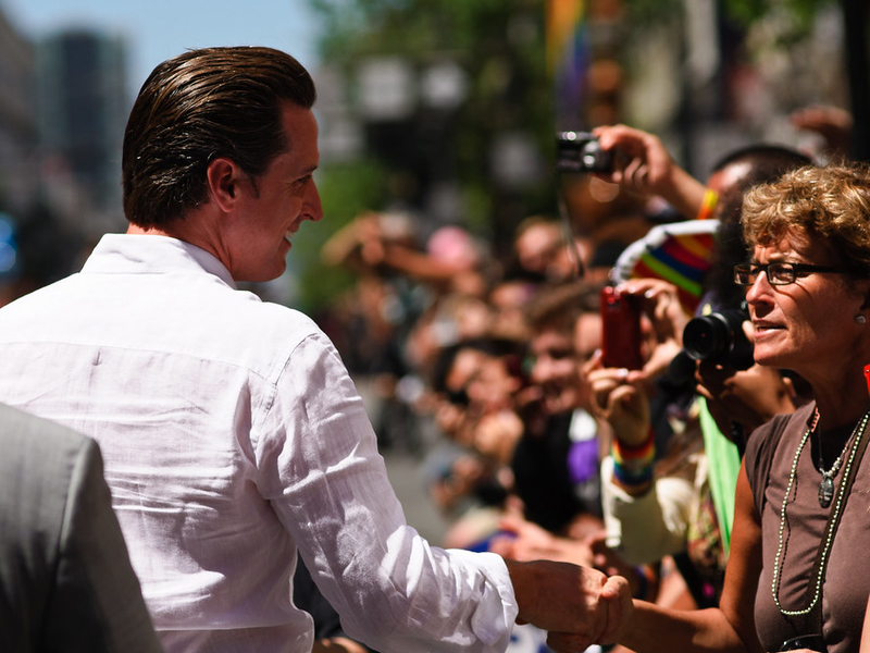 Gavin Newsom, mayor of San Francisco, shaking hands with the public