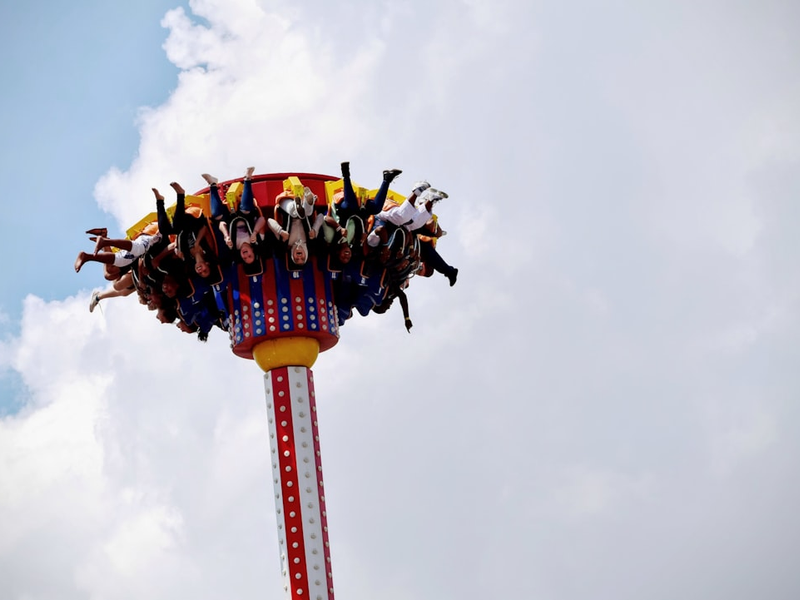 people riding on amusement park
