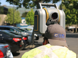 man looking at device on road