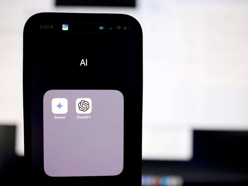 a close up of a cell phone with an ai button