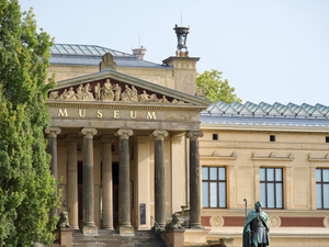 a building with a statue in front of it