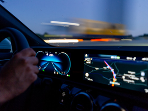 person's hand on steering wheel
