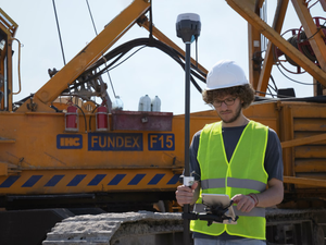 Land surveyor on construction site