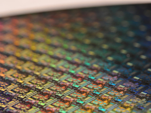 This is a macro of a silicon wafer. Each square is a chip with microscopic transistors and circuits. Ordinarily, wafers like these are diced into their individual chips and the chips go into the processors that power our computers.  Sometimes, wafers have flaws and the manufacturers dispose of them instead. That’s how I got mine. After visiting the tech museums in Silicon Valley, I was amazed at the beauty of silicon wafers, so I started collecting and photographing them.  Like fractals and flowers, the closer you get to them, the more amazing details there are to see.