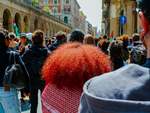 a crowd of people walking down a street