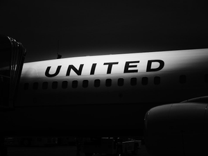 white and black airplane during night time