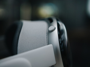 Close-up of the right side of Apple Vision Pro on a blurred background